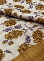 Kadamparii Silk cream semi tussar silk saree with mustard purple floral print and mustard border, displayed on a white background.