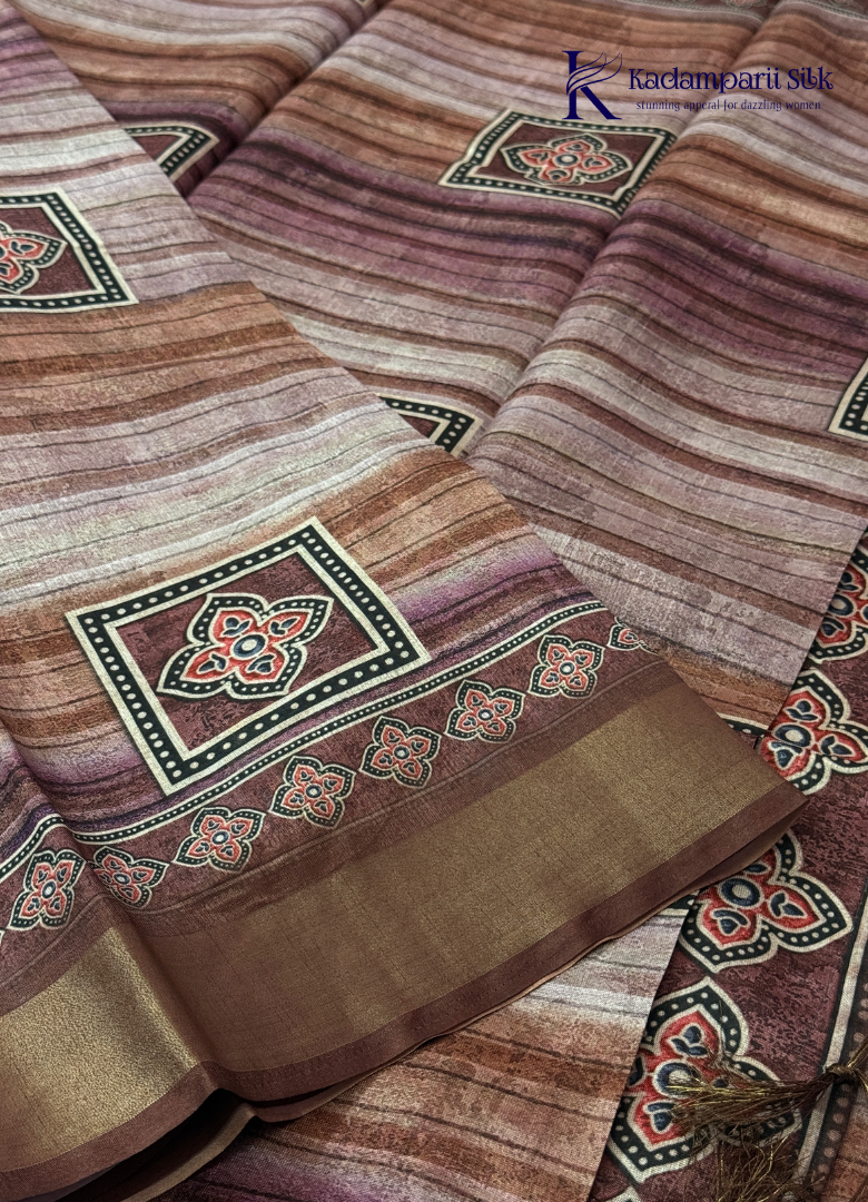 Kadamparii Silk brown soft tussar silk saree with digital print body and traditional motif border, displayed on a white background.