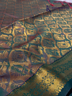 Kadamparii Silk magenta and olive green semi soft silk saree with intricate gold zari weaving, traditional motifs, rich contrast pallu, elegant border, and tassel detailing.
