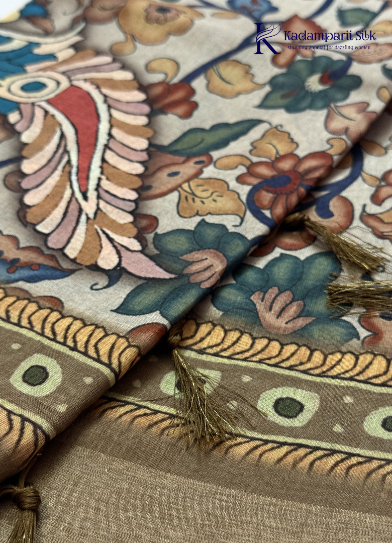 Kadamparii Silk beige soft tussar silk saree with Kalamkari style floral print and traditional border, displayed on a white background.
