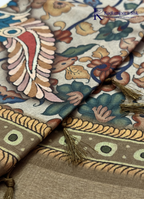 Kadamparii Silk beige soft tussar silk saree with Kalamkari style floral print and traditional border, displayed on a white background.