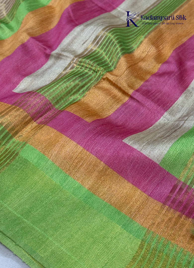 Drape yourself in this Soft Tussar Silk Saree, featuring a graceful botanical leaf print on a subtle beige body, complemented by a vibrant multicolor contrast border. Lightweight, elegant, and effortlessly stylish—perfect for every occasion.