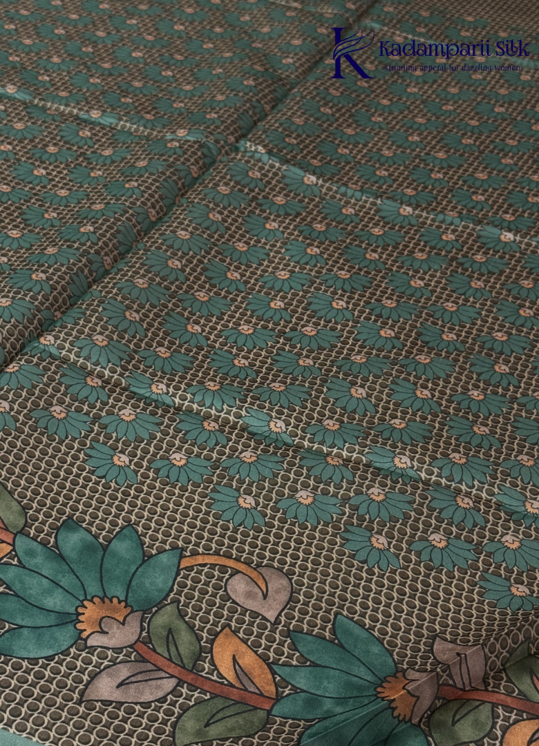 Kadamparii Silk sea green semi tussar silk saree with floral printed mundhi and elegant border, displayed on a white background.