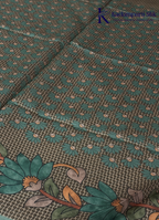 Kadamparii Silk sea green semi tussar silk saree with floral printed mundhi and elegant border, displayed on a white background.