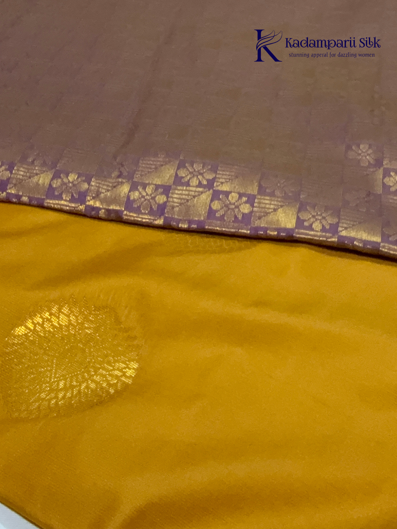 Kadamparii Silk mustard yellow semi soft silk saree with gold zari motifs, rich purple checkered zari pallu, ornate woven border, royal blue accents, and tassel detailing.