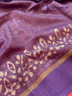 Blush pink semi tussar saree with traditional batik print and purple contrast pallu by Kadamparii Silk.