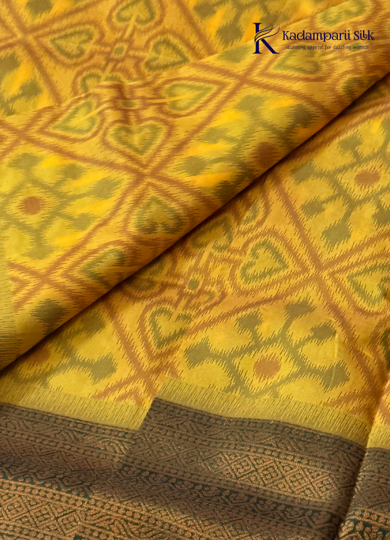 Kadamparii Silk mustard semi soft silk saree with Pochampally design and contrast woven border, displayed on a white background.