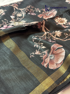 Black semi tussar saree with floral digital print and subtle golden zari border by Kadamparii Silk.
