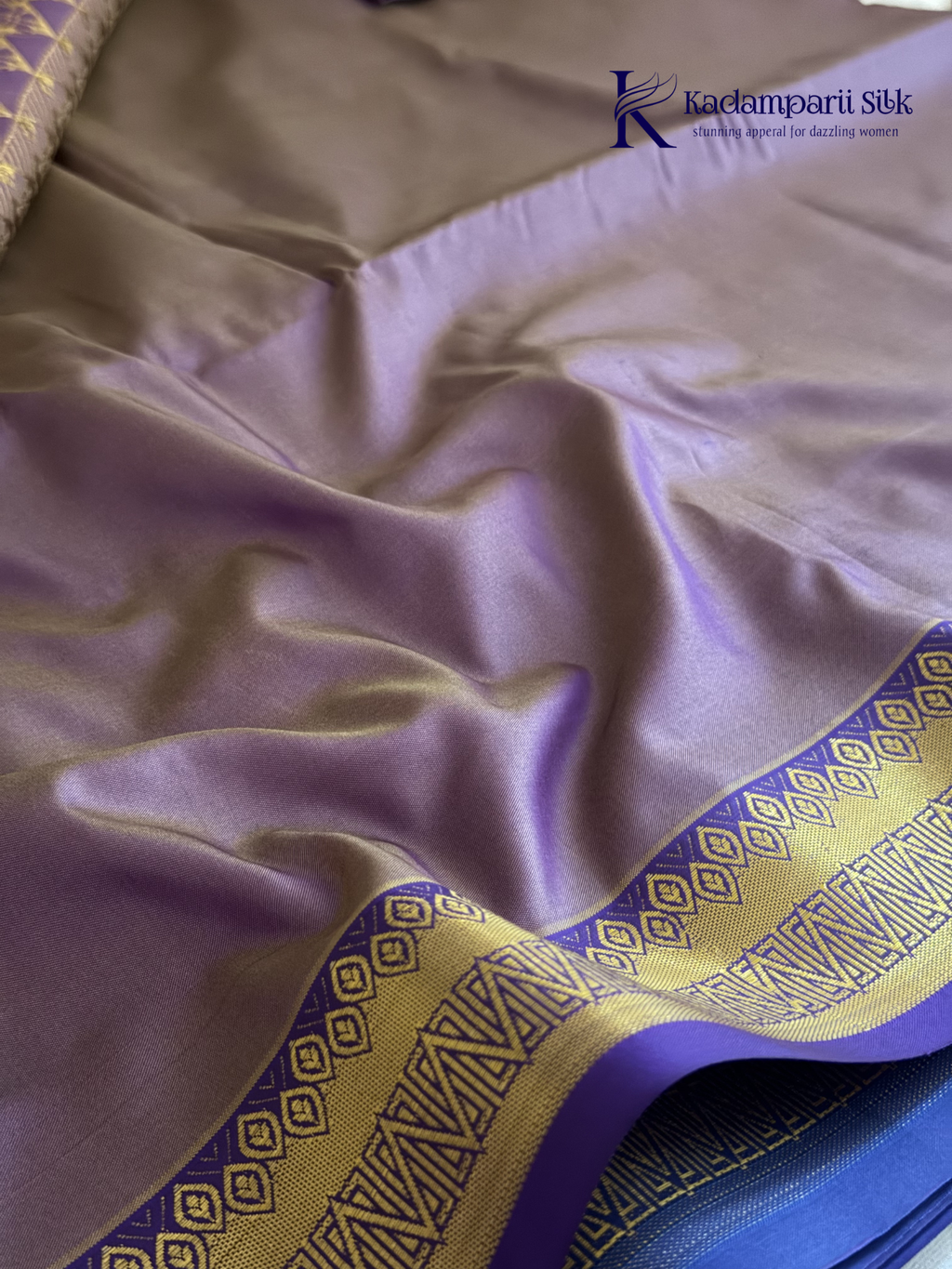 Kadamparii Silk teal blue semi soft silk saree with gold zari motifs, rich purple checkered zari pallu, ornate woven border, royal blue accents, and tassel detailing.