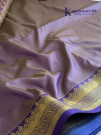 Kadamparii Silk teal blue semi soft silk saree with gold zari motifs, rich purple checkered zari pallu, ornate woven border, royal blue accents, and tassel detailing.