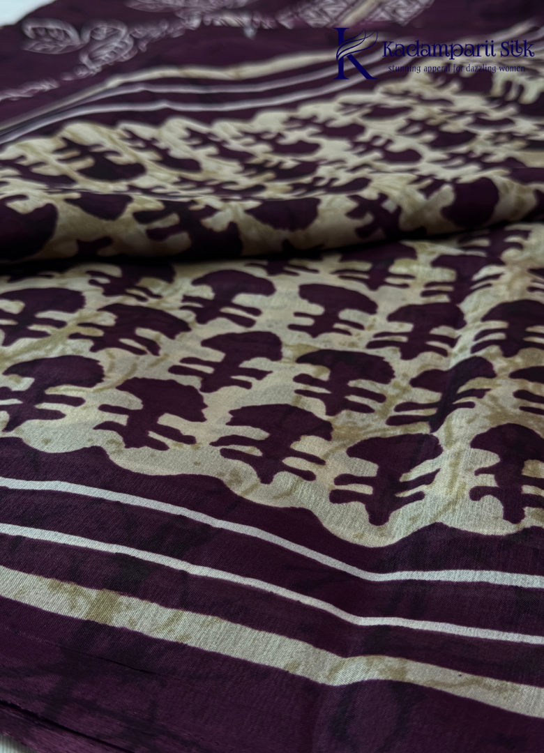 Kadamparii Silk beige semi tussar silk printed saree with wine colour pattern and matching striped border, displayed on a white background.