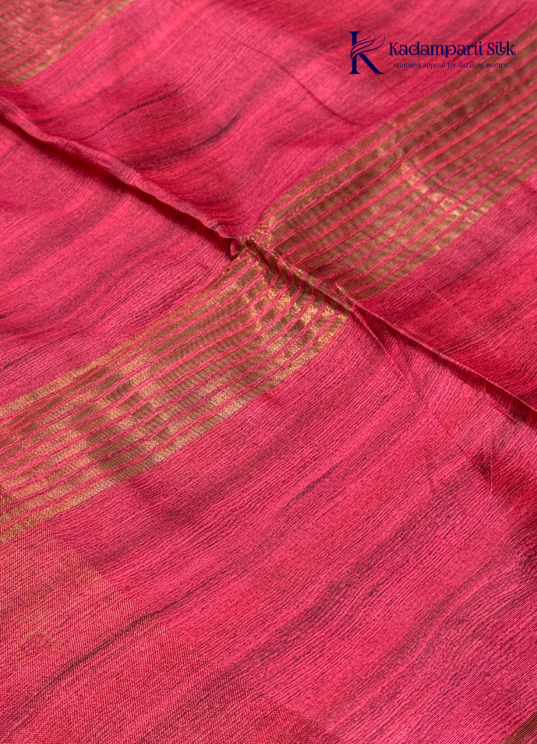 Adorn yourself in this Soft Tussar Silk Saree, featuring a graceful olive green body embellished with delicate floral buttas and finished with a striking rose pink contrast border. Lightweight, elegant, and effortlessly stylish—perfect for every special occasion.