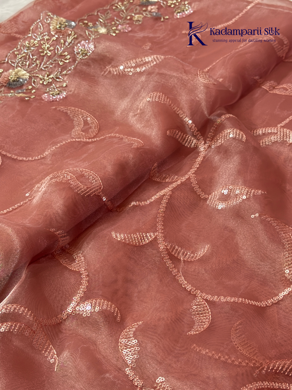 Rose pink shimmer silk saree with elegant sequin embroidery, soft shimmer texture, scalloped border detailing, lightweight flowy fabric, and glamorous partywear styling by Kadamparii Silk.