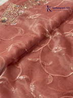 Rose pink shimmer silk saree with elegant sequin embroidery, soft shimmer texture, scalloped border detailing, lightweight flowy fabric, and glamorous partywear styling by Kadamparii Silk.