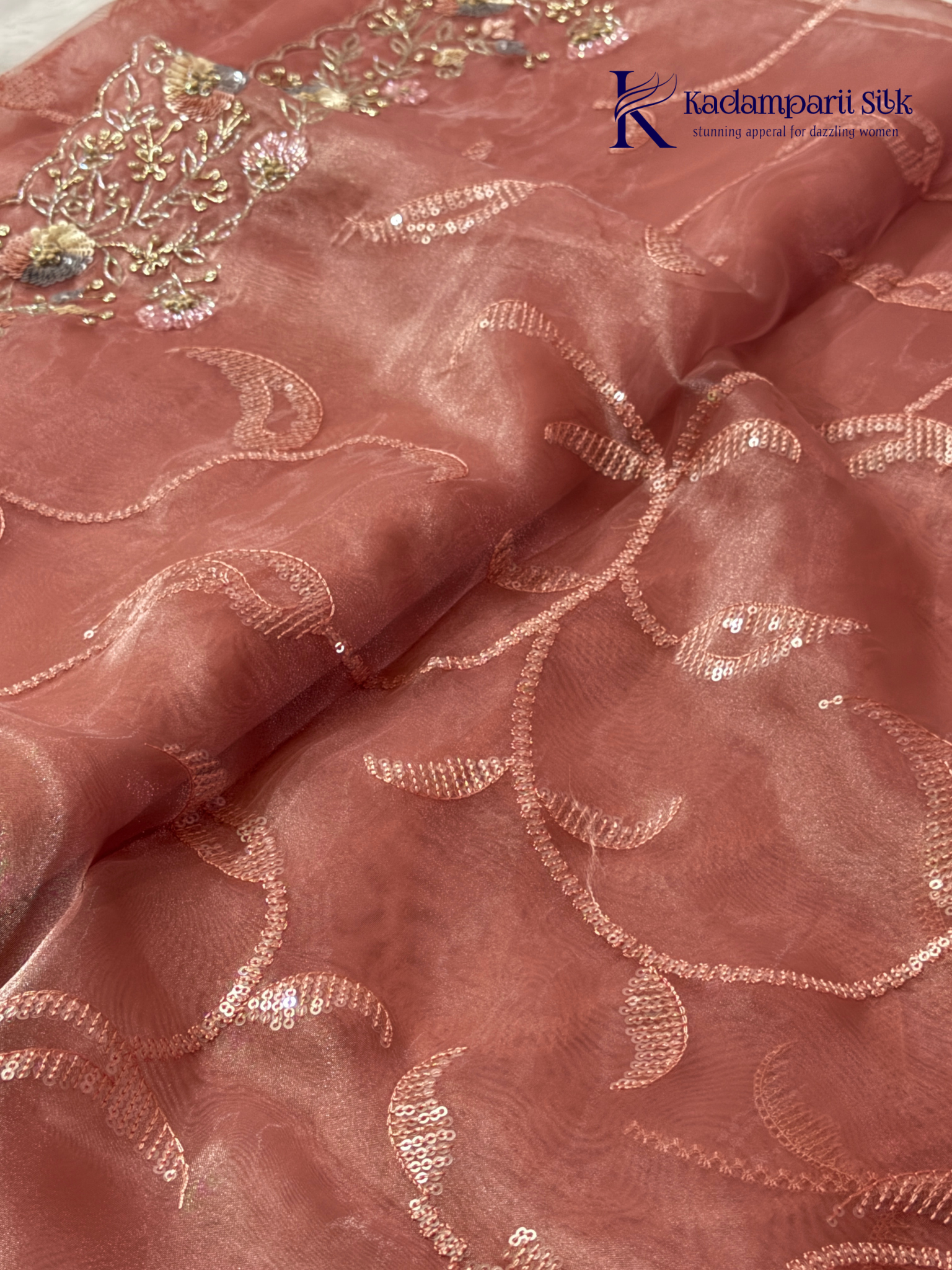 Rose pink shimmer silk saree with elegant sequin embroidery, soft shimmer texture, scalloped border detailing, lightweight flowy fabric, and glamorous partywear styling by Kadamparii Silk.