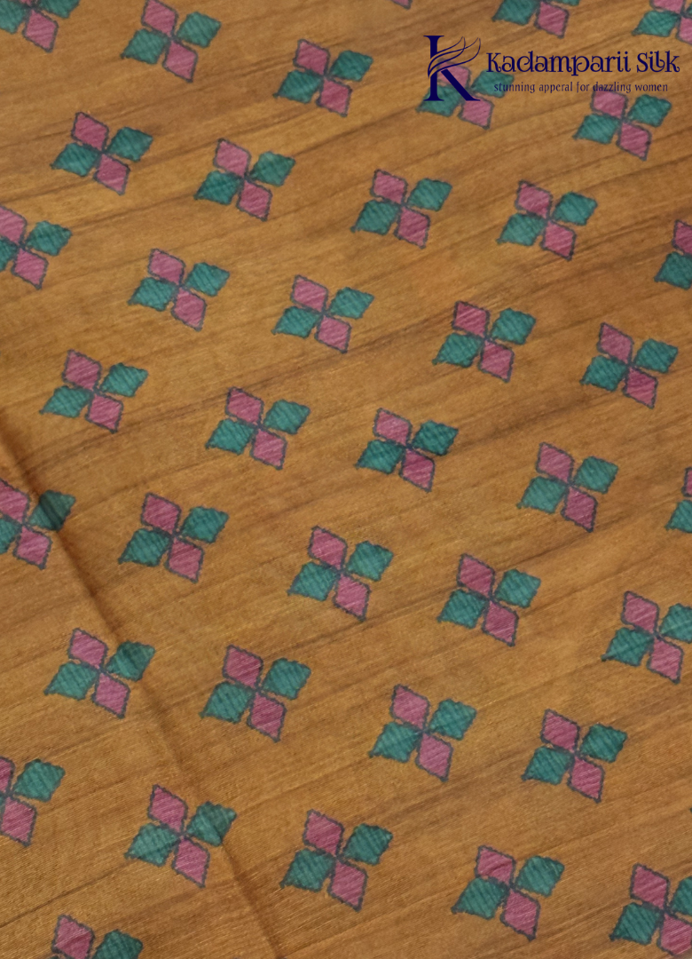 Kadamparii Silk mustard semi tussar silk saree with artistic printed mundhi and colourful floral traditional motifs, displayed on a white background.