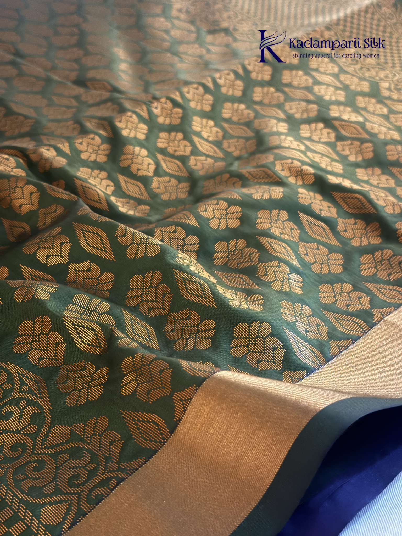 Kadamparii Silk royal purple semi soft silk saree with olive green zari woven pallu, intricate checkered motifs, copper gold zari border, geometric zari designs, and tassel detailing.
