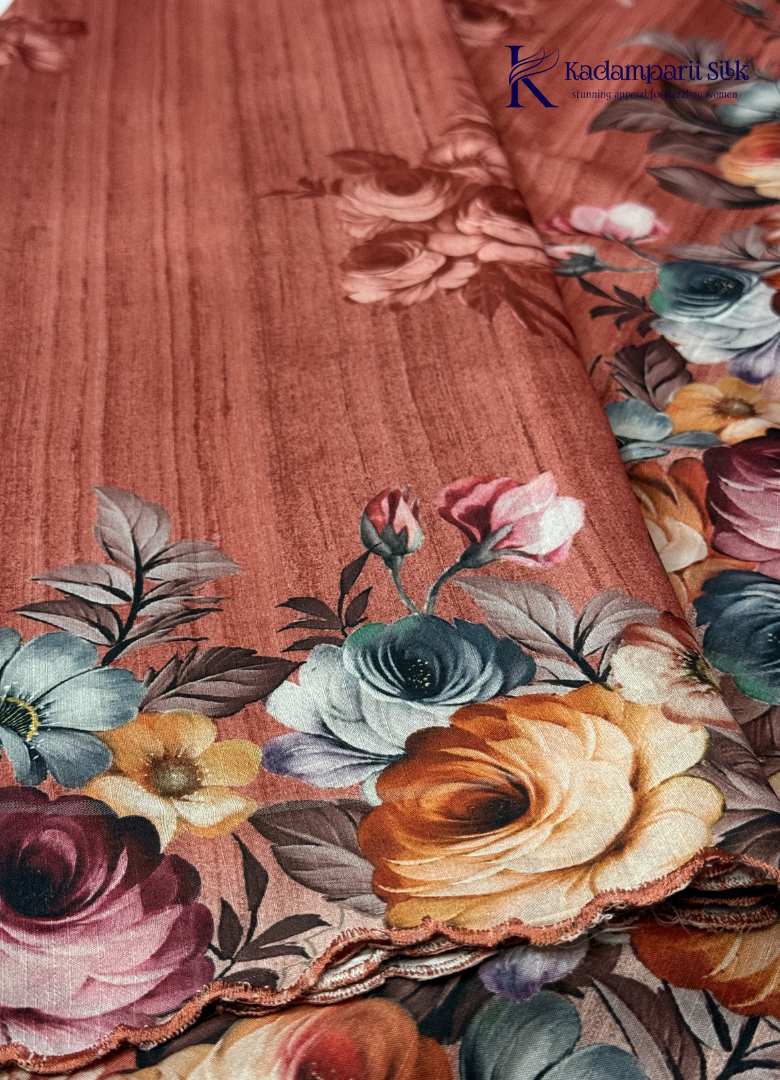 Kadamparii Silk rust orange tussar saree with digital body and multicolour floral border, displayed on a white background.