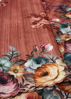 Kadamparii Silk rust orange tussar saree with digital body and multicolour floral border, displayed on a white background.