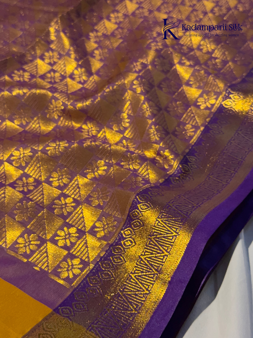 Kadamparii Silk mustard yellow semi soft silk saree with gold zari motifs, rich purple checkered zari pallu, ornate woven border, royal blue accents, and tassel detailing.