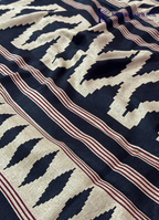 Kadamparii Silk beige and black semi tussar silk saree with abstract design and subtle motif detailing, displayed on a white background.