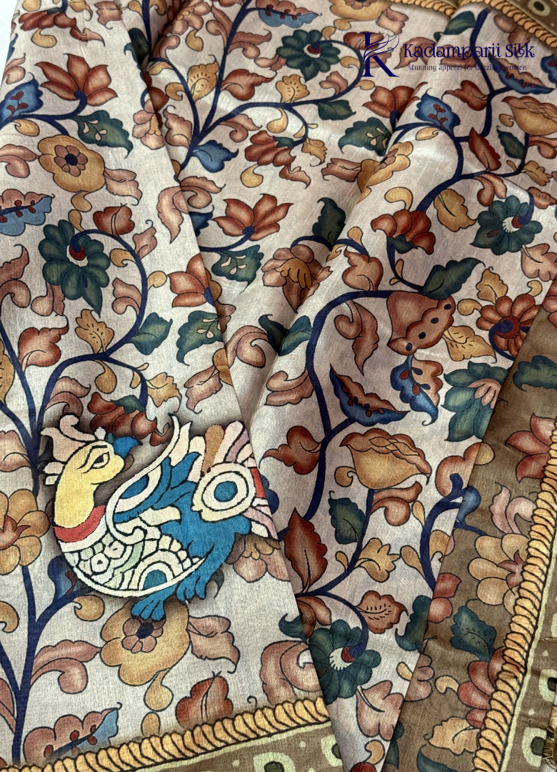 Kadamparii Silk beige soft tussar silk saree with Kalamkari style floral print and traditional border, displayed on a white background.