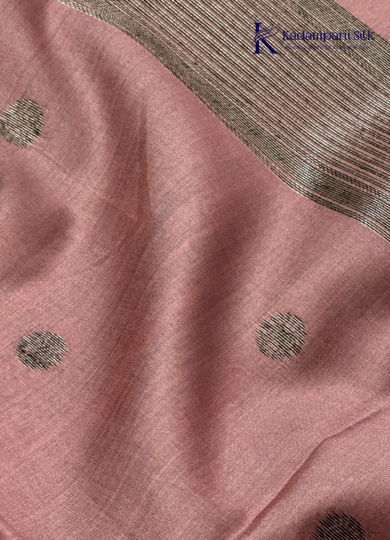 Kadamparii Silk dusty pink raw silk saree with antique zari border and subtle motif detailing, displayed on a white background.