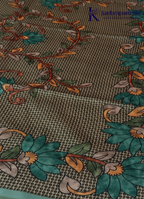 Kadamparii Silk sea green semi tussar silk saree with floral printed mundhi and elegant border, displayed on a white background.
