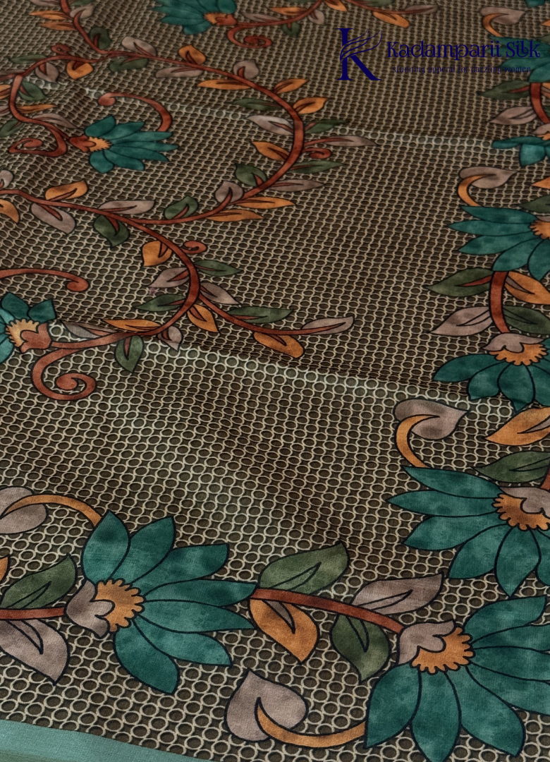 Kadamparii Silk sea green semi tussar silk saree with floral printed mundhi and elegant border, displayed on a white background.
