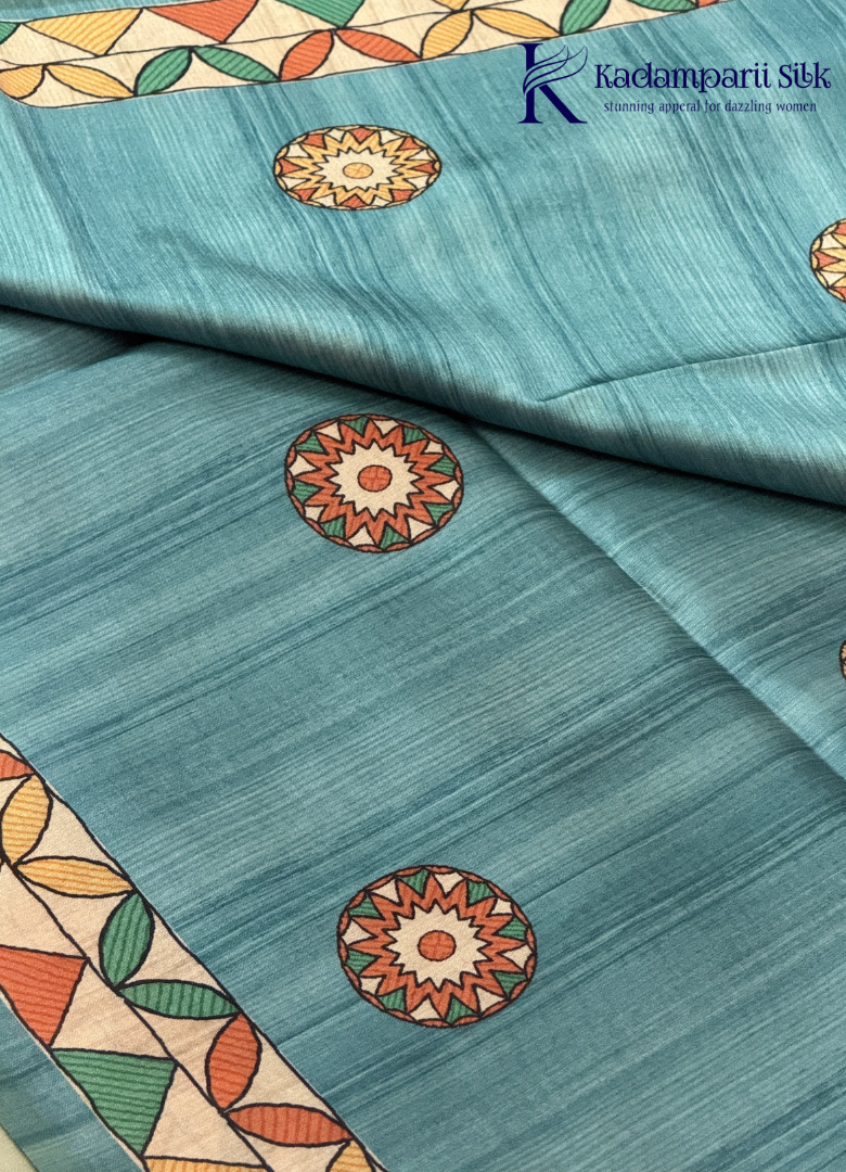 Kadamparii Silk green semi tussar silk saree with floral printed mundhi and multicolour border, displayed on a white background.