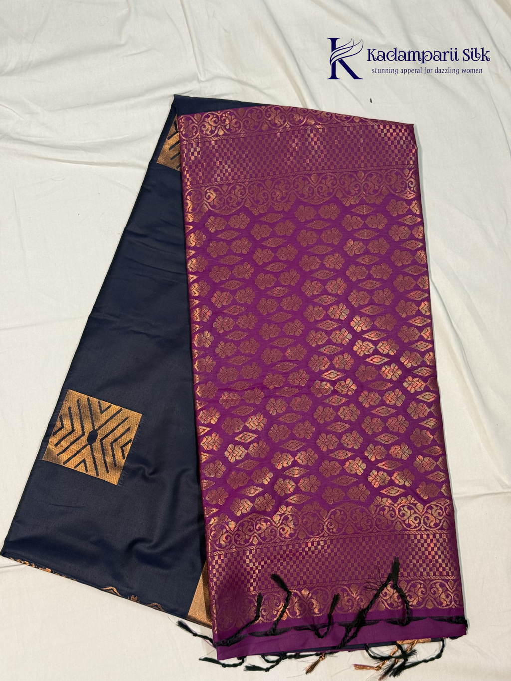 Kadamparii Silk navy blue semi soft silk saree with vibrant magenta zari woven pallu, intricate checkered motifs, copper gold zari border, and elegant tassel detailing.