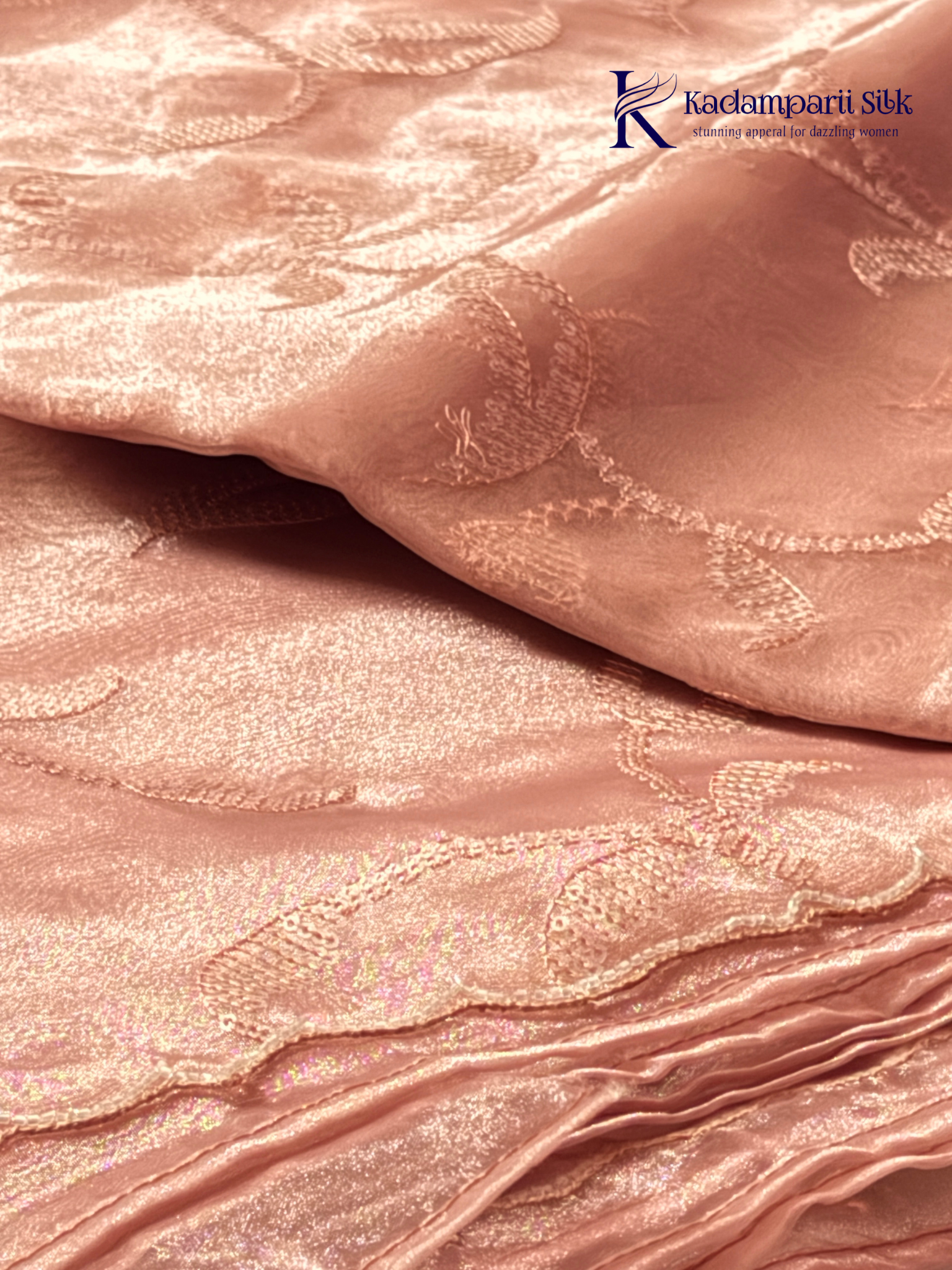 Rose pink shimmer silk saree with elegant sequin embroidery, soft shimmer texture, scalloped border detailing, lightweight flowy fabric, and glamorous partywear styling by Kadamparii Silk.