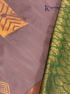 Kadamparii Silk taupe brown semi soft silk saree with olive green zari woven pallu, intricate checkered and floral vine motifs, copper gold zari border, elegant tassels, and traditional festive design.