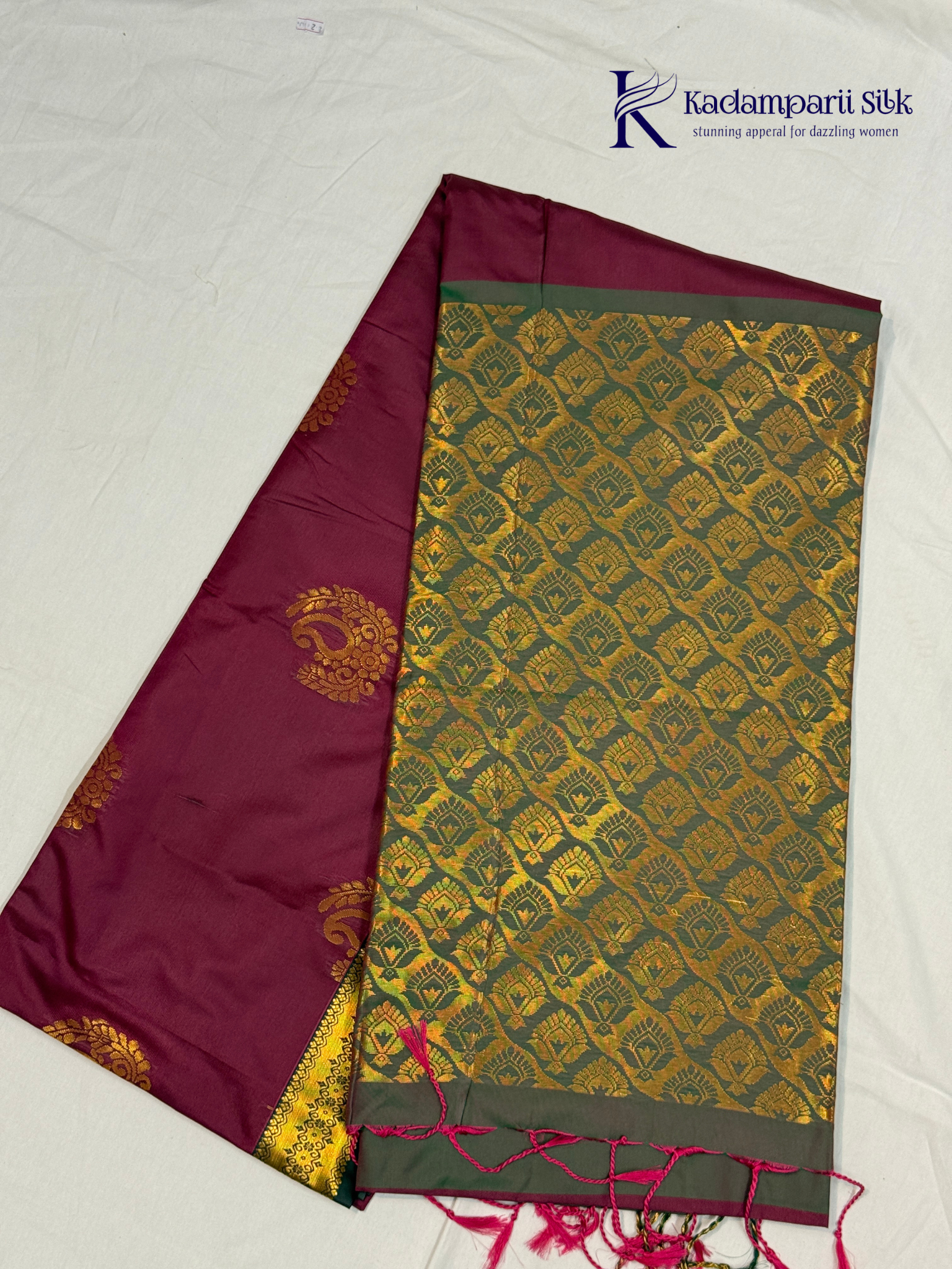 Kadamparii Silk magenta and olive green semi soft silk saree with intricate gold zari weaving, traditional motifs, rich contrast pallu, elegant border, and tassel detailing.