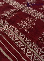 Kadamparii Silk beige semi tussar silk saree with maroon printed pattern and matching striped border, displayed on a white background.