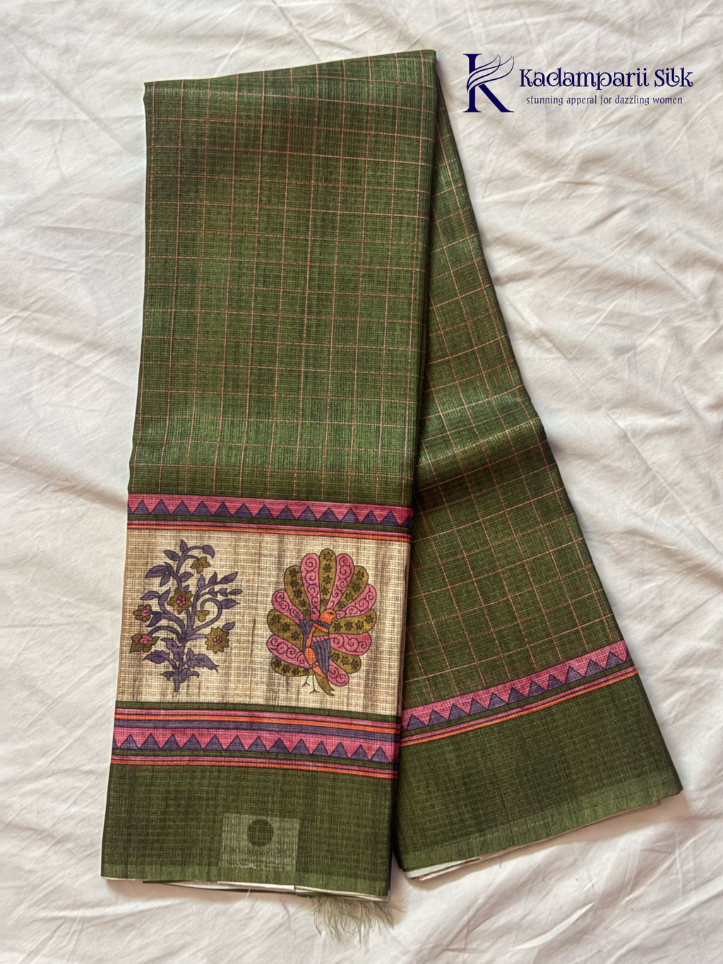 Olive green semi kota saree with checked pattern and artistic printed border by Kadamparii Silk.