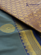 Kadamparii Silk teal blue semi soft silk saree with gold zari motifs, rich purple checkered zari pallu, ornate woven border, royal blue accents, and tassel detailing.