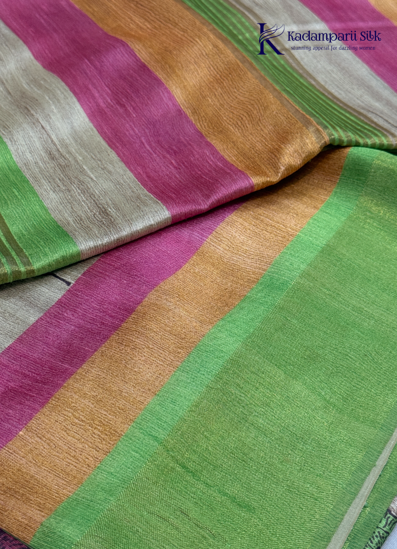 Drape yourself in this Soft Tussar Silk Saree, featuring a graceful botanical leaf print on a subtle beige body, complemented by a vibrant multicolor contrast border. Lightweight, elegant, and effortlessly stylish—perfect for every occasion.
