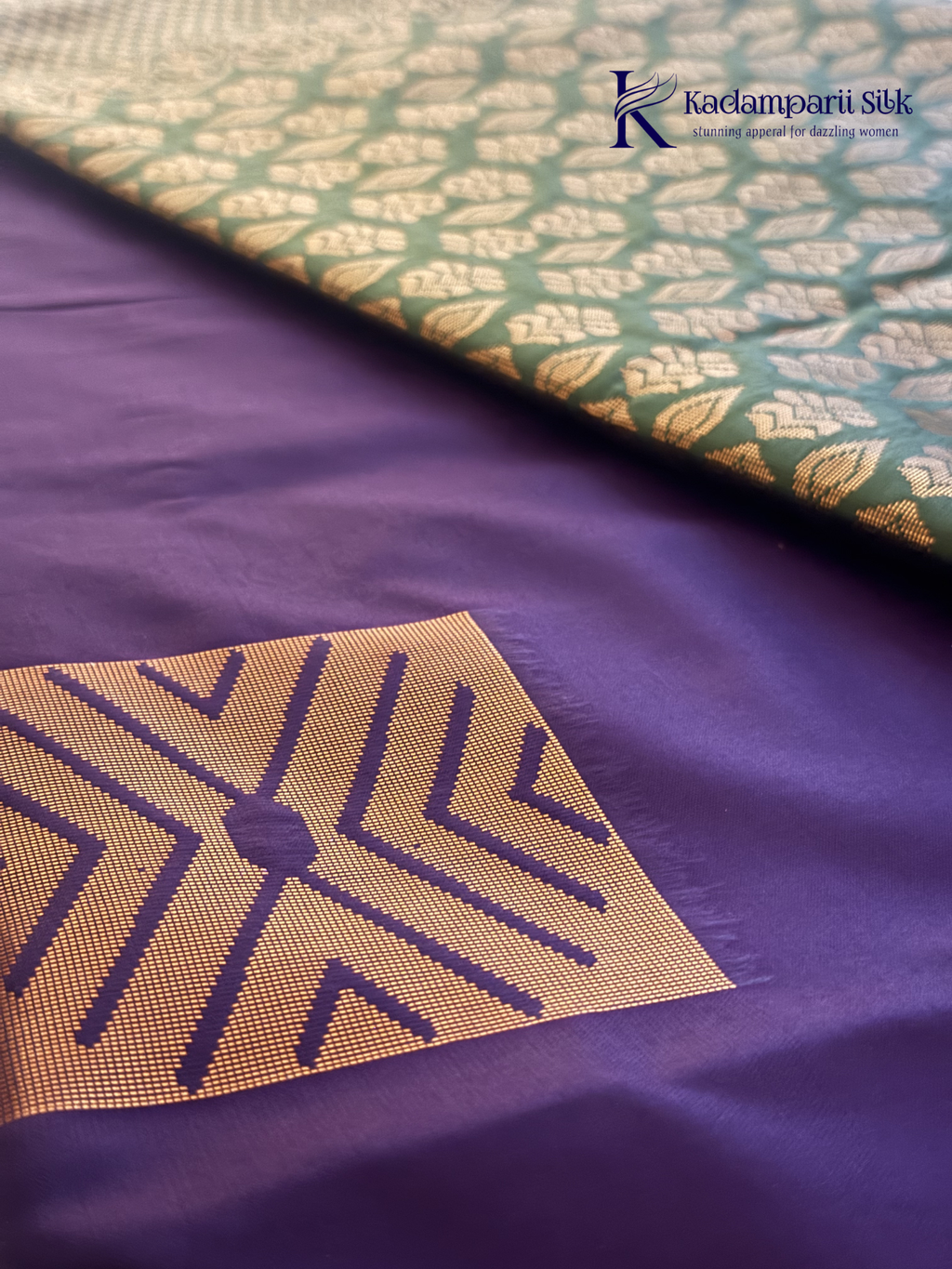 Kadamparii Silk royal purple semi soft silk saree with olive green zari woven pallu, intricate checkered motifs, copper gold zari border, geometric zari designs, and tassel detailing.