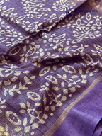 Blush pink semi tussar saree with traditional batik print and purple contrast pallu by Kadamparii Silk.