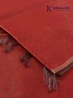 Rose pink semi Tussar jacquard saree with all-over woven geometric patterns, subtle silver zari detailing, soft textured finish, elegant tassels, and lightweight traditional drape by Kadamparii Silk.