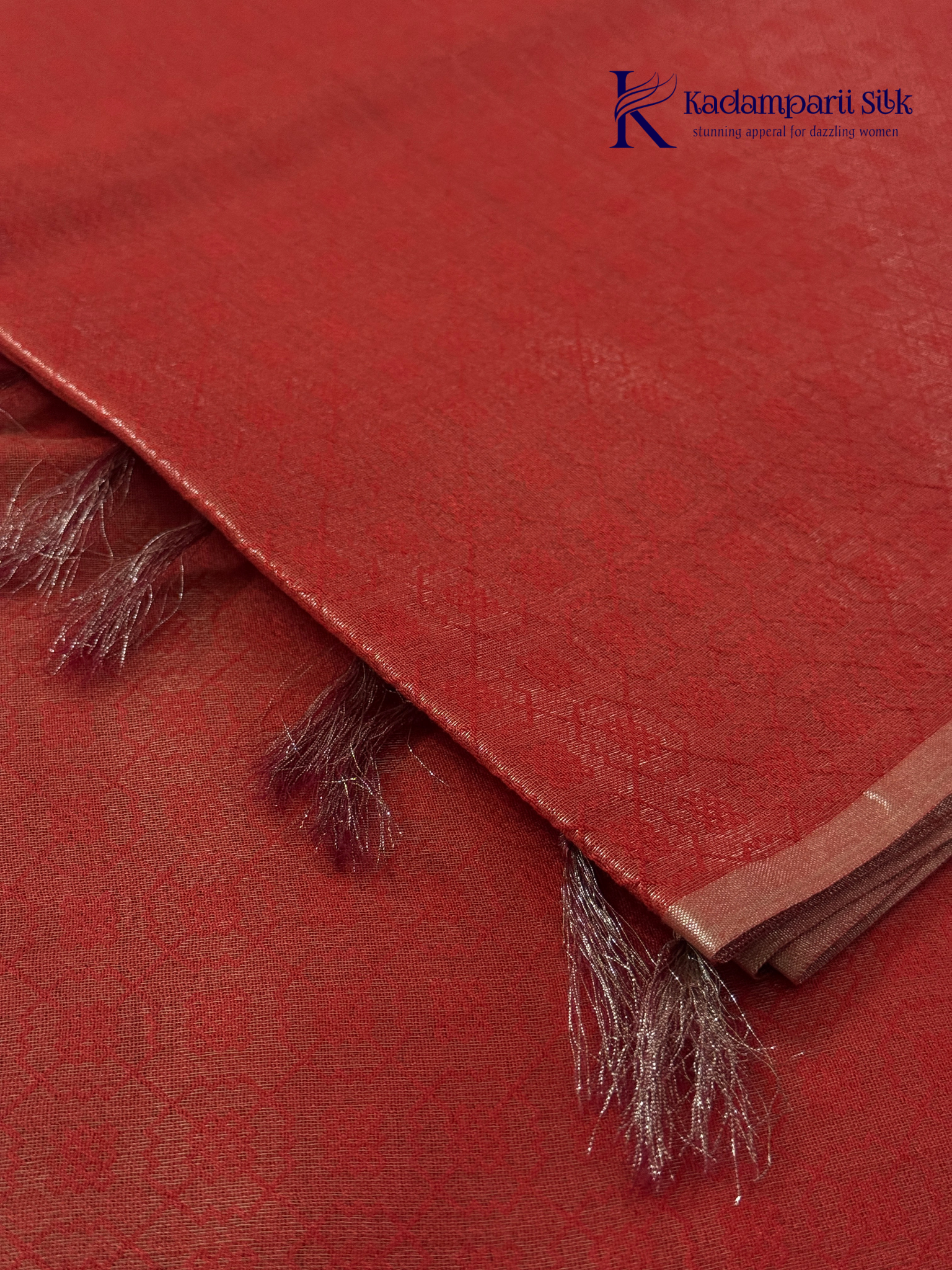 Rose pink semi Tussar jacquard saree with all-over woven geometric patterns, subtle silver zari detailing, soft textured finish, elegant tassels, and lightweight traditional drape by Kadamparii Silk.