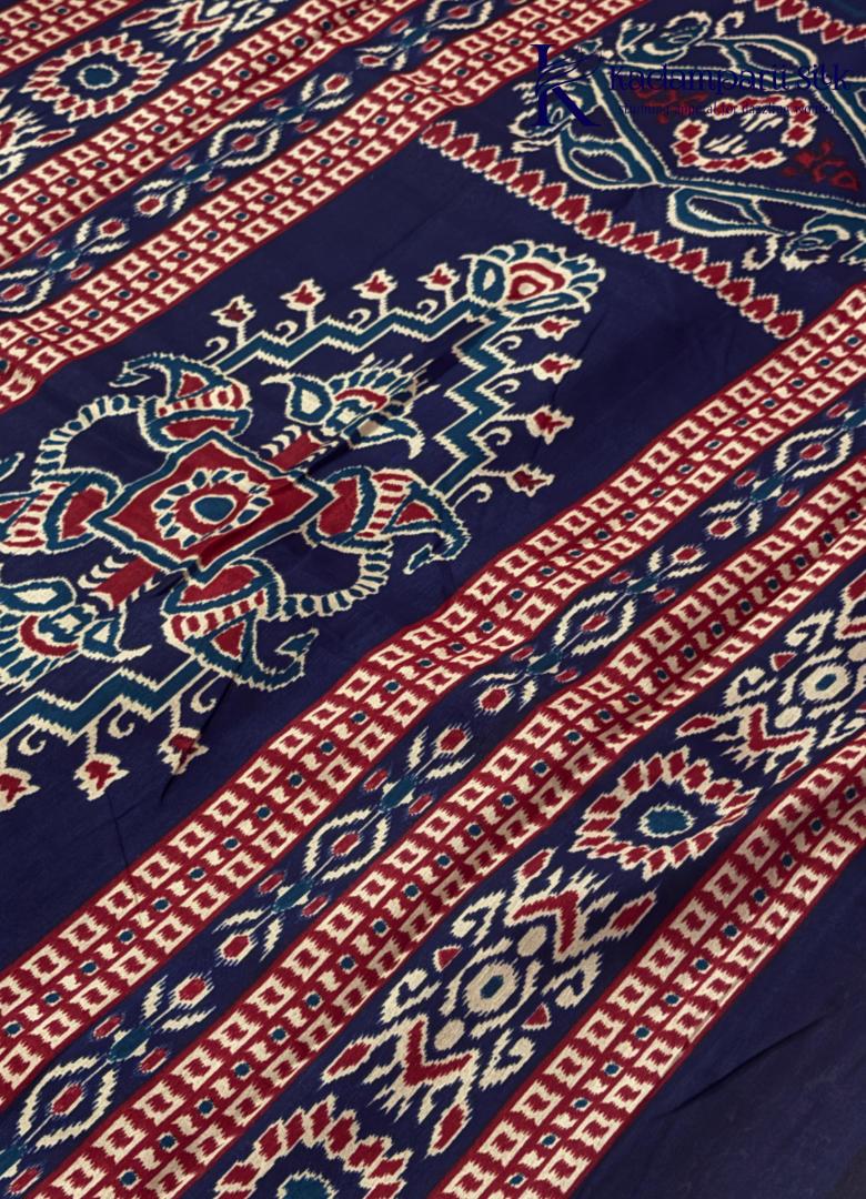 Kadamparii Silk maroon soft semi tussar silk saree with woven pattern and navy blue contrast border, displayed on a white background.