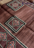 Kadamparii Silk brown soft tussar silk saree with digital print body and traditional motif border, displayed on a white background.