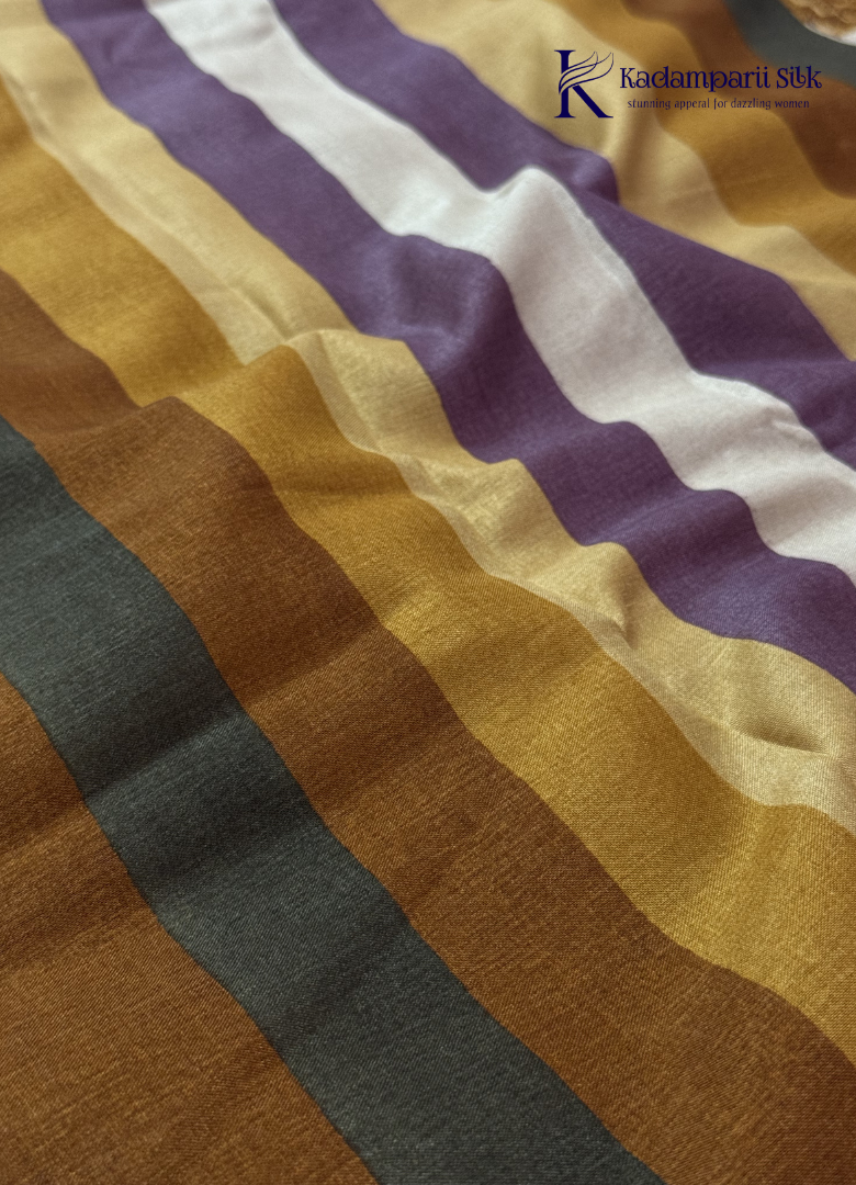Kadamparii Silk cream semi tussar silk saree with mustard purple floral print and mustard border, displayed on a white background.
