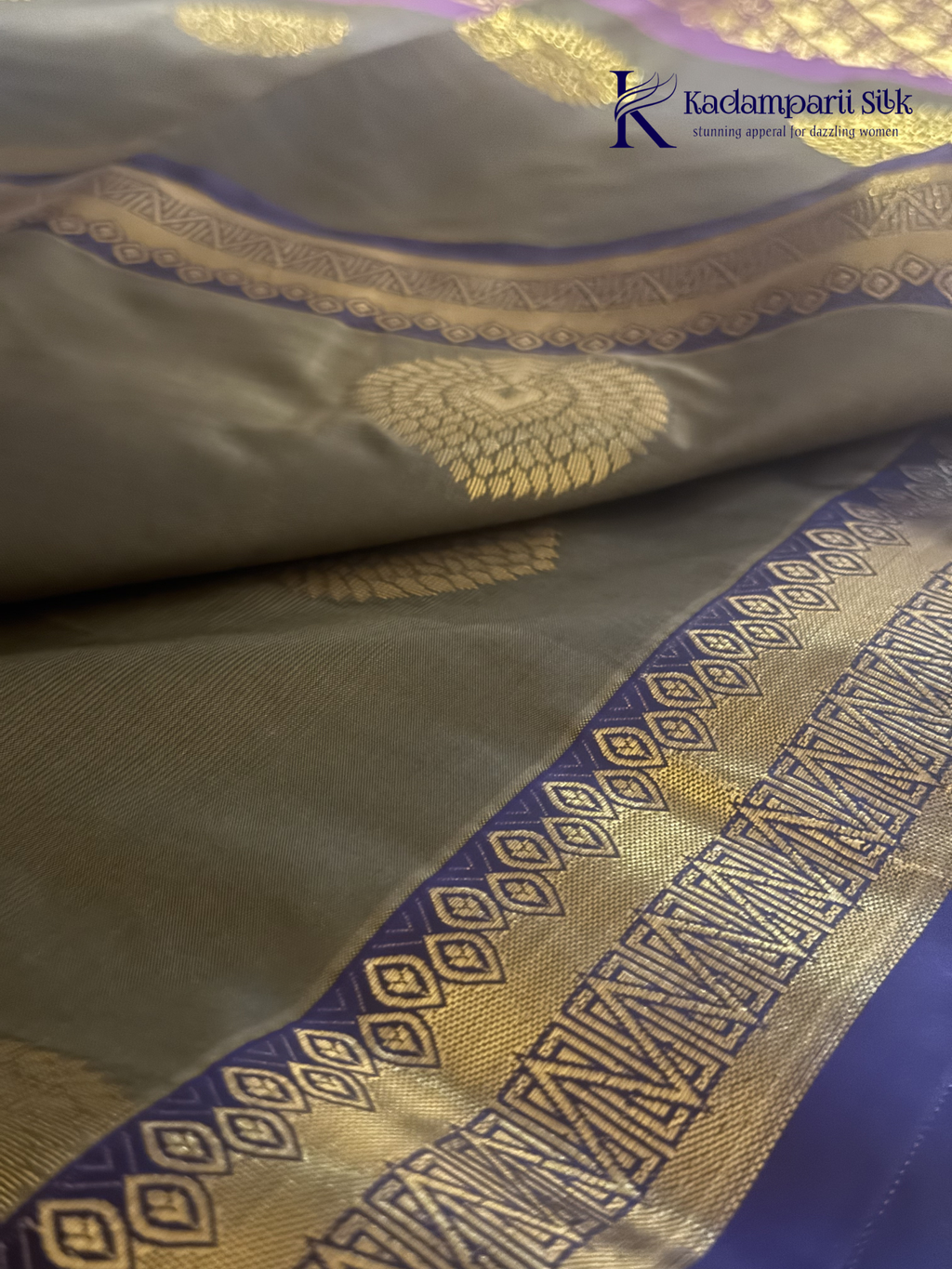 Kadamparii Silk olive green semi soft silk saree with gold zari peacock motifs, rich purple woven pallu, intricate zari border, and tassel detailing.