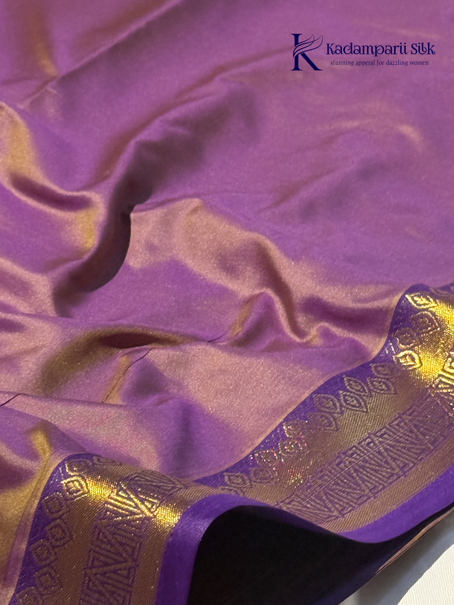 Kadamparii Silk mustard yellow semi soft silk saree with gold zari motifs, rich purple checkered zari pallu, ornate woven border, royal blue accents, and tassel detailing.