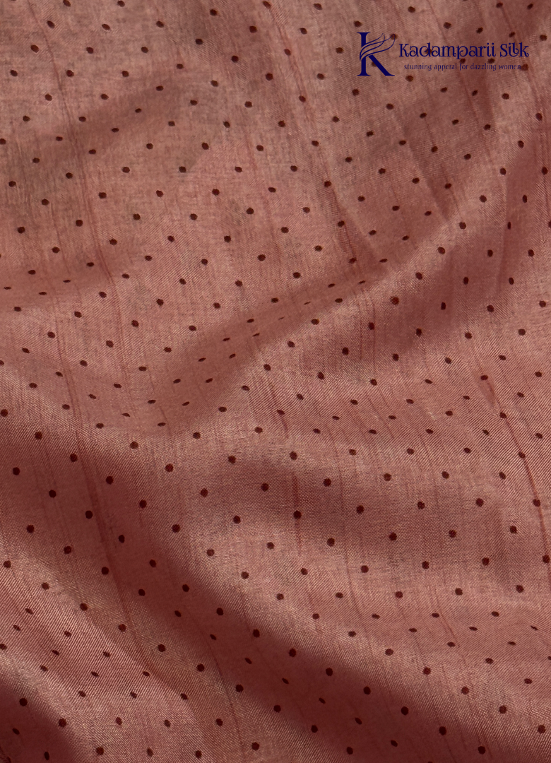 Kadamparii Silk dusty pink raw silk saree with embroidery work, subtle body motifs, and decorative border, displayed on a white background.