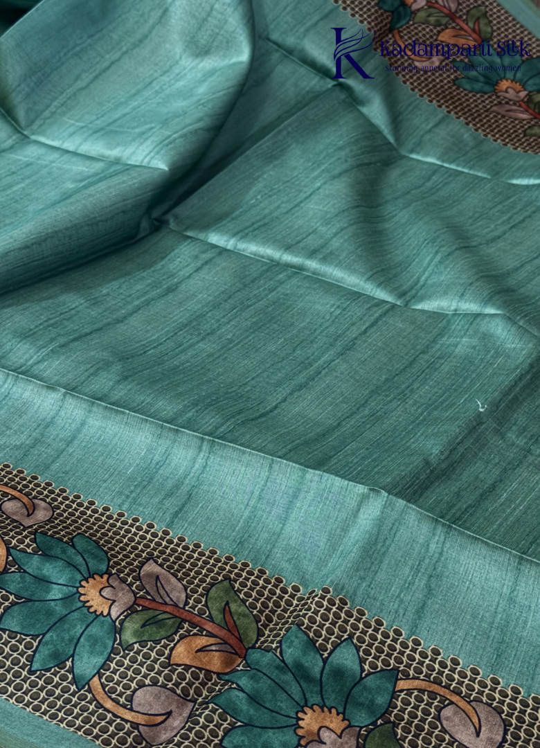 Kadamparii Silk sea green semi tussar silk saree with floral printed mundhi and elegant border, displayed on a white background.