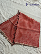 Rose pink semi Tussar jacquard saree with all-over woven geometric patterns, subtle silver zari detailing, soft textured finish, elegant tassels, and lightweight traditional drape by Kadamparii Silk.